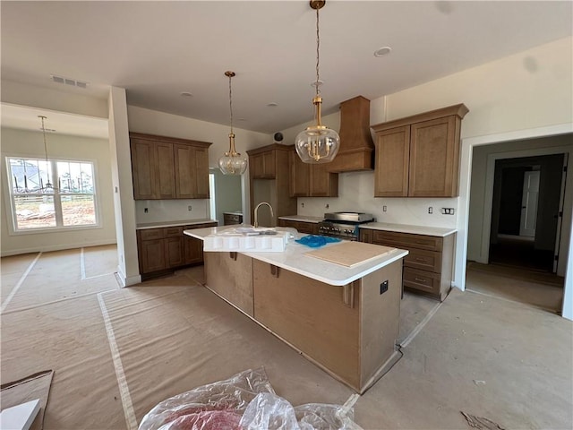 1010 Cable Rd, Waleska, GA 30183 - kitchen featuring stainless steel stove, brown cabinetry, light countertops, and pendant lighting