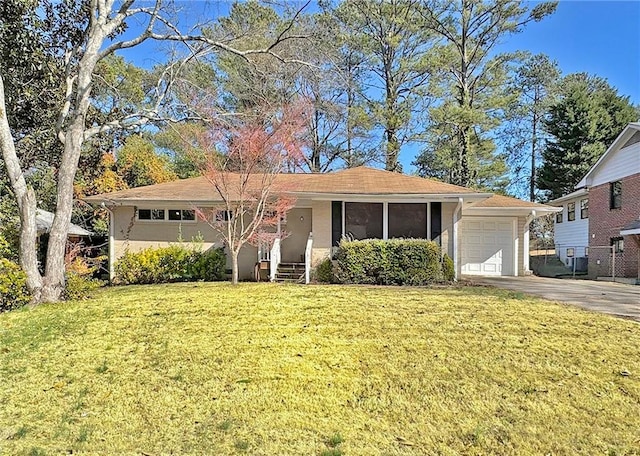 ranch-style home with a garage and a front yard