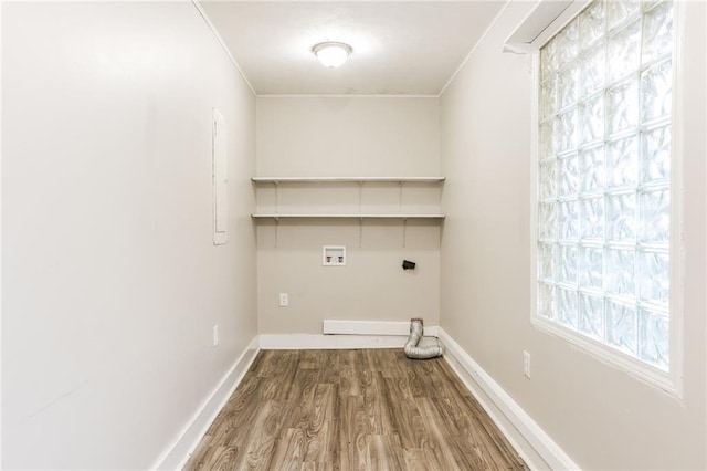 laundry room with hookup for an electric dryer, ornamental molding, hardwood / wood-style floors, and washer hookup