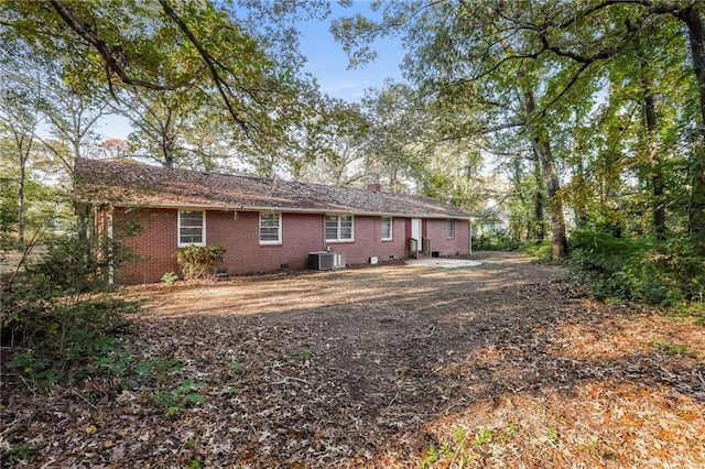 rear view of property with central air condition unit