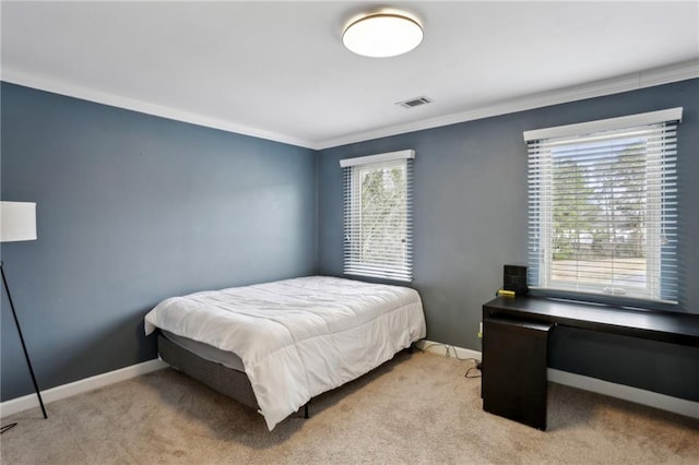 bedroom with visible vents, light colored carpet, crown molding, and baseboards