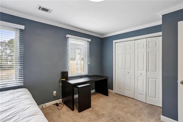 bedroom featuring visible vents, ornamental molding, a closet, baseboards, and light colored carpet