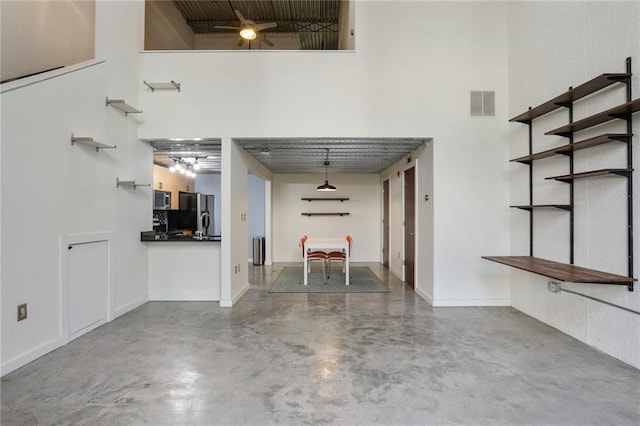 garage with black fridge