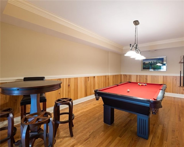 rec room with hardwood / wood-style flooring, ornamental molding, and pool table