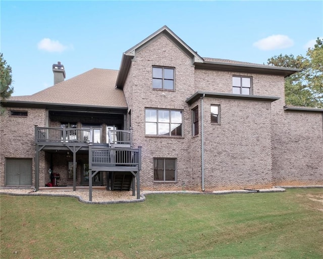 back of house featuring a deck and a yard