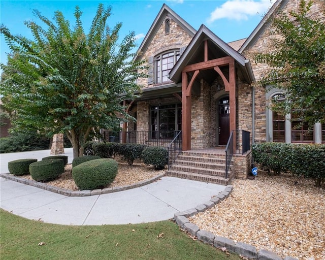 craftsman-style home featuring cooling unit and a porch