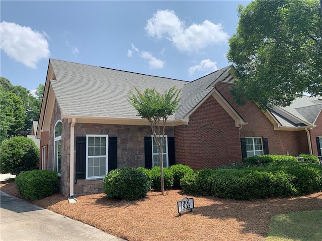 1301 Haven Cir, Douglasville, GA 30135 - ranch-style house with stone siding, roof with shingles, and brick siding