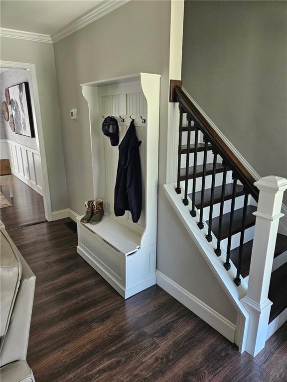 2467 Sky Valley Dr, Dacula, GA 30019 - mudroom featuring wood finished floors and crown molding