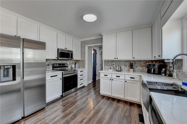 2467 Sky Valley Dr, Dacula, GA 30019 - kitchen with stainless steel appliances, white cabinetry, backsplash, dark wood-style floors, and light countertops
