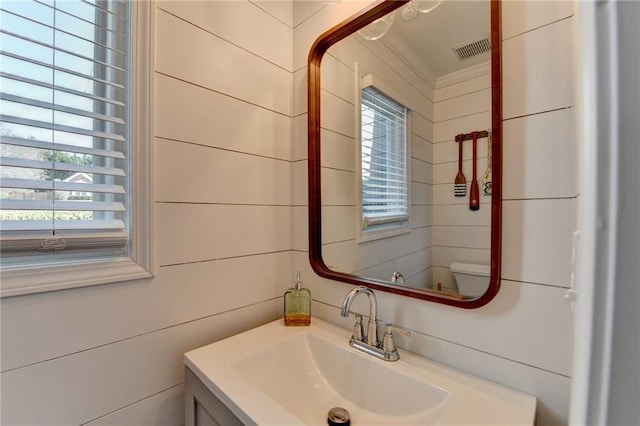 2467 Sky Valley Dr, Dacula, GA 30019 - half bathroom featuring vanity and healthy amount of natural light