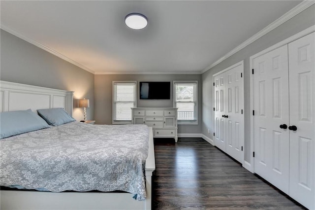2467 Sky Valley Dr, Dacula, GA 30019 - bedroom featuring ornamental molding, multiple closets, and dark wood-style flooring