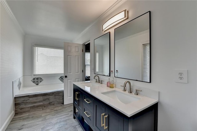 2467 Sky Valley Dr, Dacula, GA 30019 - full bathroom with crown molding, double vanity, a garden tub, and wood finished floors