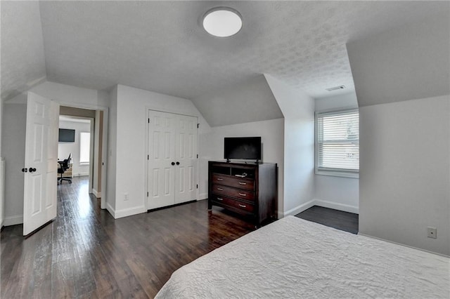 2467 Sky Valley Dr, Dacula, GA 30019 - bedroom with lofted ceiling and wood finished floors