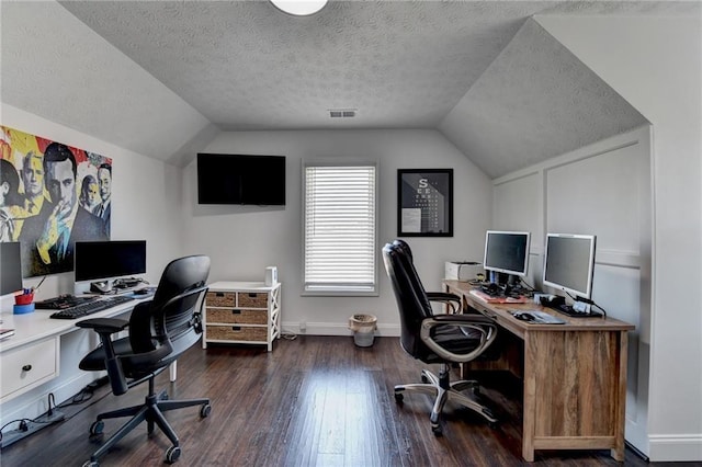 2467 Sky Valley Dr, Dacula, GA 30019 - office area with lofted ceiling, wood finished floors, and a textured ceiling