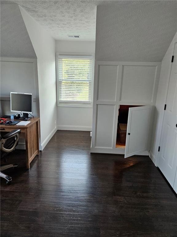 2467 Sky Valley Dr, Dacula, GA 30019 - bonus room with dark wood-type flooring, a textured ceiling, and a desk