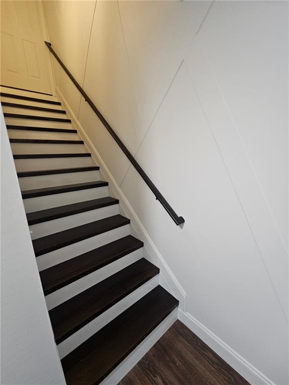 2467 Sky Valley Dr, Dacula, GA 30019 - stairs featuring wood finished floors and baseboards