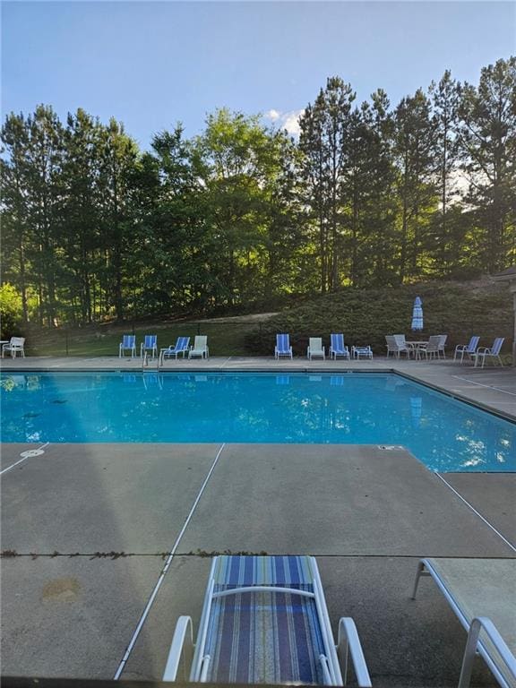 2467 Sky Valley Dr, Dacula, GA 30019 - community pool with a patio area
