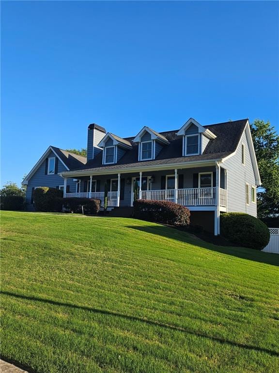 2467 Sky Valley Dr, Dacula, GA 30019 - cape cod-style house featuring covered porch and a front lawn