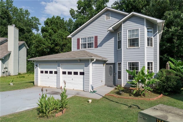 view of property featuring a garage and a front lawn