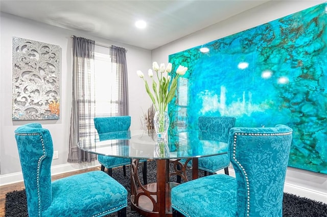 dining space featuring recessed lighting, wood finished floors, and baseboards