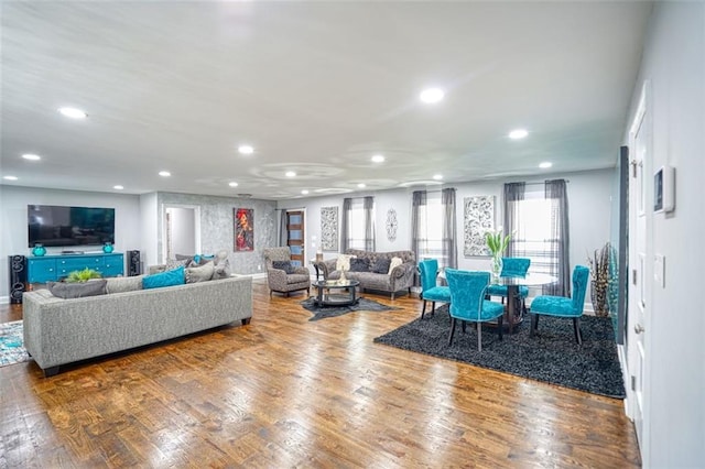 living room with wood finished floors and recessed lighting