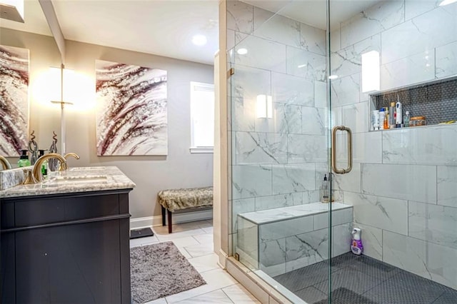 full bathroom with vanity, marble finish floor, and a stall shower