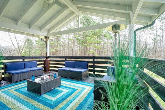 wooden deck with an outdoor hangout area