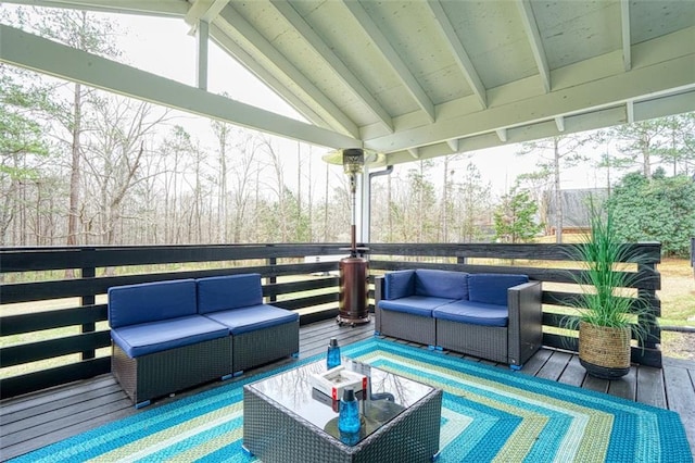 wooden terrace with an outdoor hangout area