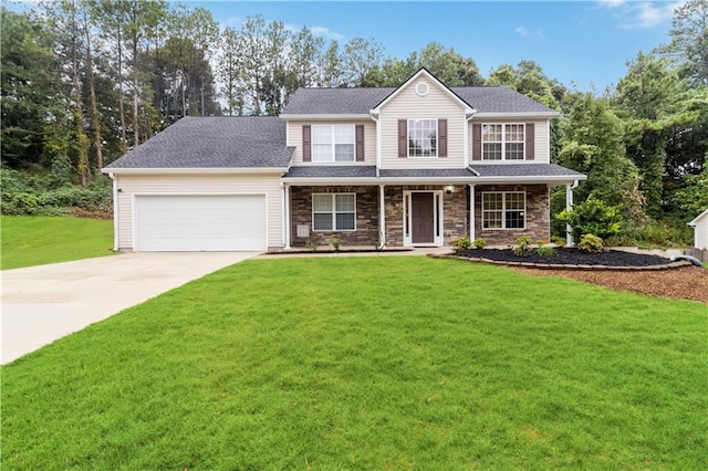 view of front of house featuring a front lawn, a garage, and a porch