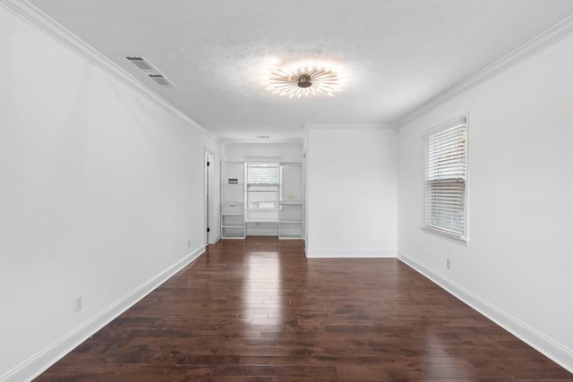 1647 Grandeus Ln SW, Stone Mountain, GA 30087 - unfurnished room with wood finished floors, crown molding, baseboards, and a textured ceiling