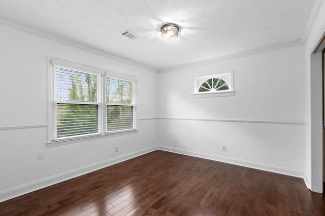 1647 Grandeus Ln SW, Stone Mountain, GA 30087 - unfurnished room featuring healthy amount of natural light, dark wood finished floors, crown molding, baseboards, and a textured ceiling
