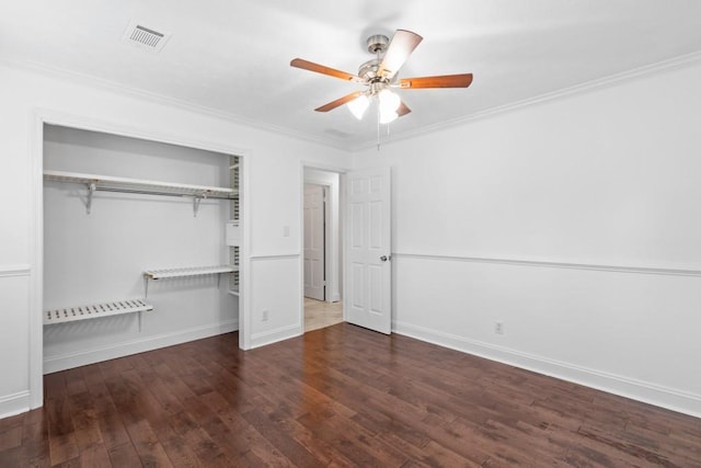 1647 Grandeus Ln SW, Stone Mountain, GA 30087 - unfurnished bedroom with wood finished floors, ornamental molding, a closet, baseboards, and a ceiling fan