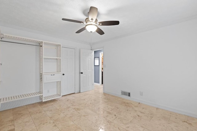 1647 Grandeus Ln SW, Stone Mountain, GA 30087 - unfurnished bedroom featuring a ceiling fan and baseboards