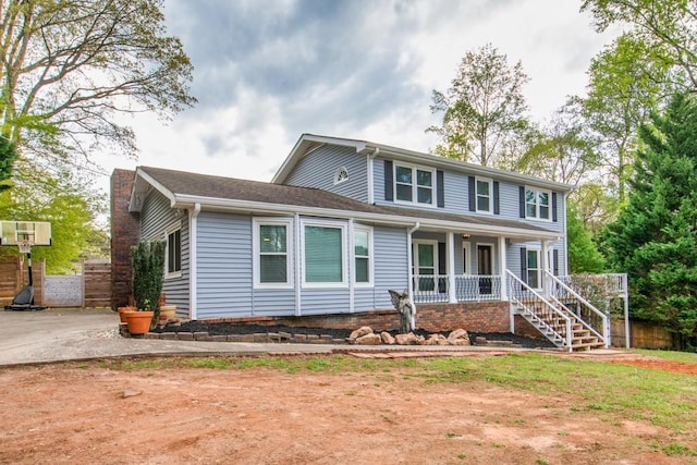 1647 Grandeus Ln SW, Stone Mountain, GA 30087 - view of front of home with covered porch, a chimney, and stairway