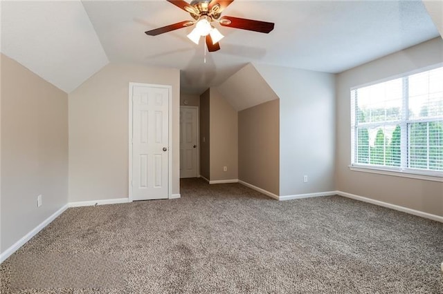 bonus room with carpet, lofted ceiling, and baseboards