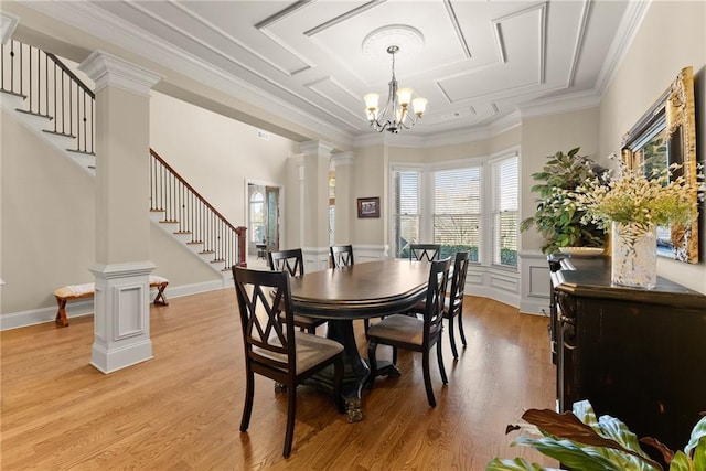 4729 Deer Creek Ct, Flowery Branch, GA 30542 - dining area featuring stairway, decorative columns, a chandelier, light wood-style floors, and crown molding