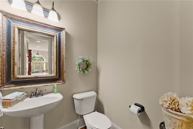 4729 Deer Creek Ct, Flowery Branch, GA 30542 - half bathroom with baseboards, toilet, and a sink