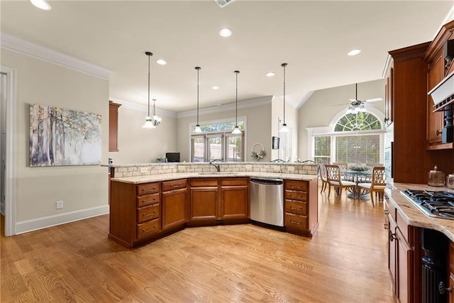 4729 Deer Creek Ct, Flowery Branch, GA 30542 - kitchen featuring stainless steel appliances, ceiling fan, light wood-style flooring, hanging light fixtures, and light stone counters