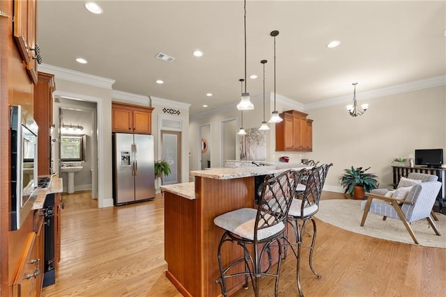 4729 Deer Creek Ct, Flowery Branch, GA 30542 - kitchen with stainless steel fridge with ice dispenser, a peninsula, brown cabinetry, a chandelier, and recessed lighting