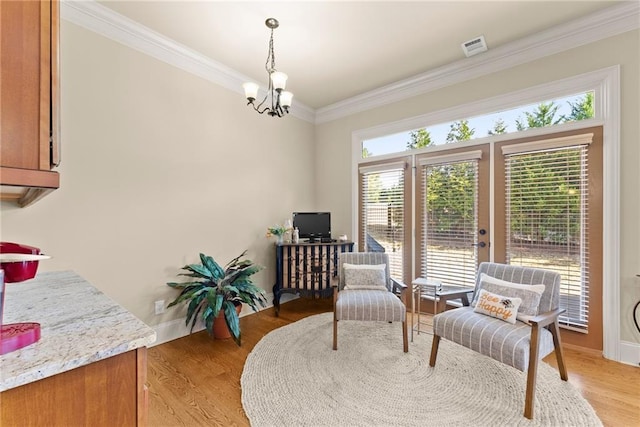 4729 Deer Creek Ct, Flowery Branch, GA 30542 - living area featuring a chandelier, ornamental molding, light wood-style floors, and french doors