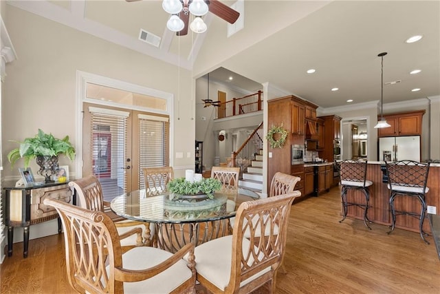 4729 Deer Creek Ct, Flowery Branch, GA 30542 - dining space with crown molding, a ceiling fan, light wood-type flooring, recessed lighting, and stairway