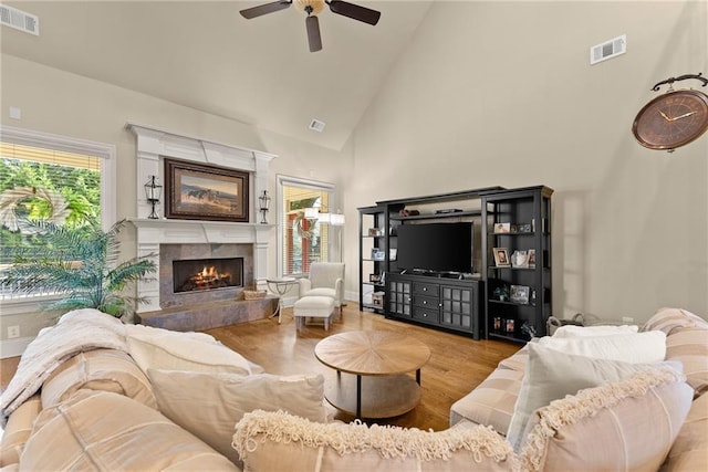 4729 Deer Creek Ct, Flowery Branch, GA 30542 - living area with high vaulted ceiling, a ceiling fan, wood finished floors, and a fireplace