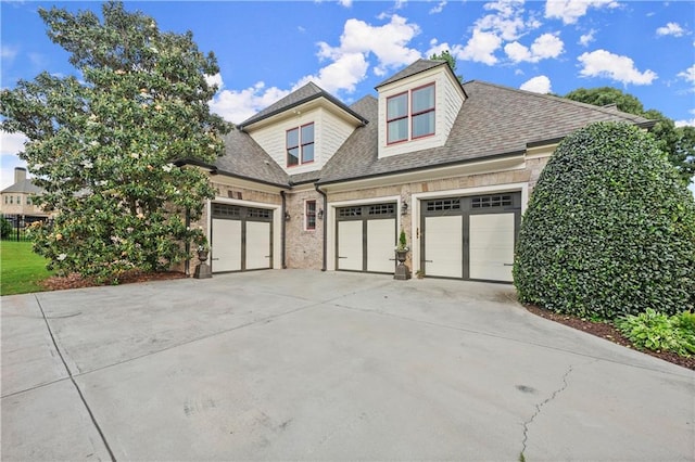 4729 Deer Creek Ct, Flowery Branch, GA 30542 - view of front of home with a garage, concrete driveway, and a shingled roof