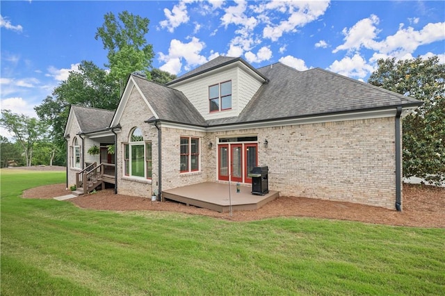 4729 Deer Creek Ct, Flowery Branch, GA 30542 - rear view of property featuring a yard, brick siding, roof with shingles, and a wooden deck