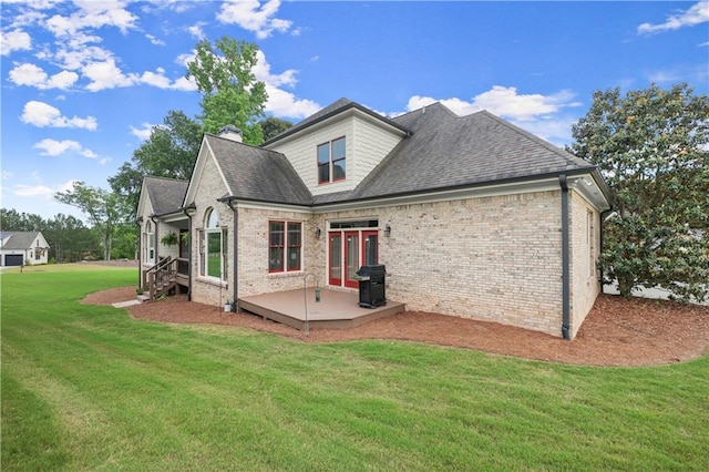 4729 Deer Creek Ct, Flowery Branch, GA 30542 - back of house with a yard, brick siding, roof with shingles, and a chimney