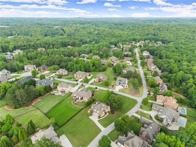 4729 Deer Creek Ct, Flowery Branch, GA 30542 - aerial perspective of suburban area with a heavily wooded area