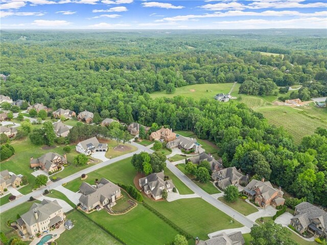 4729 Deer Creek Ct, Flowery Branch, GA 30542 - aerial perspective of suburban area featuring a heavily wooded area