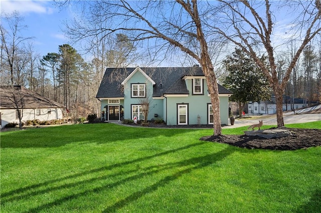 view of front of property with a front lawn