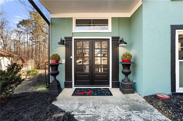 property entrance featuring french doors