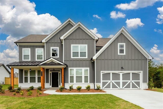 8245 Dawson View Way, Cumming, GA 30028 - view of front facade featuring a shingled roof, a front lawn, driveway, board and batten siding, and a standing seam roof